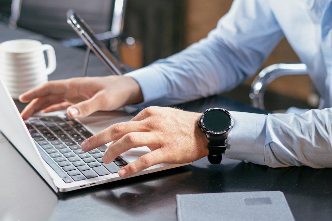 HR professional reviewing employment information on a laptop