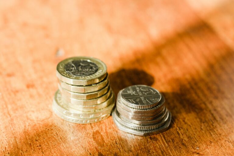 UK pound coins representing savings and cash