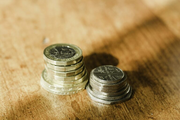 British pound coins representing personal savings and interest