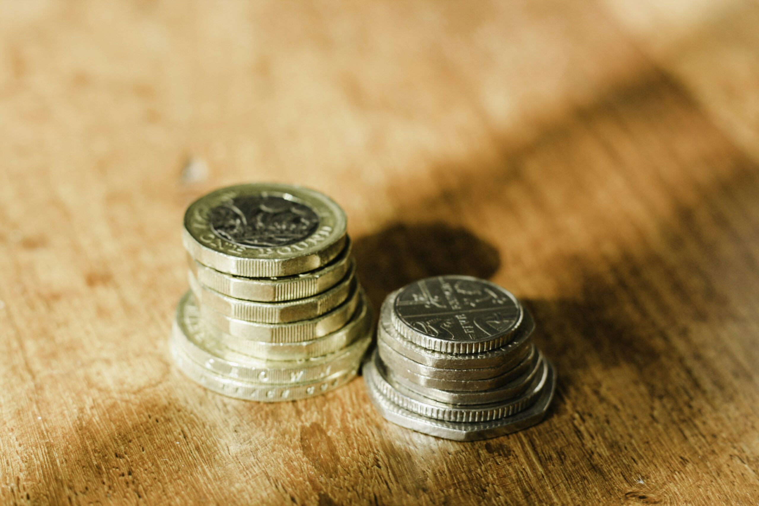 British Pound Coins Representing Personal Savings and Interest